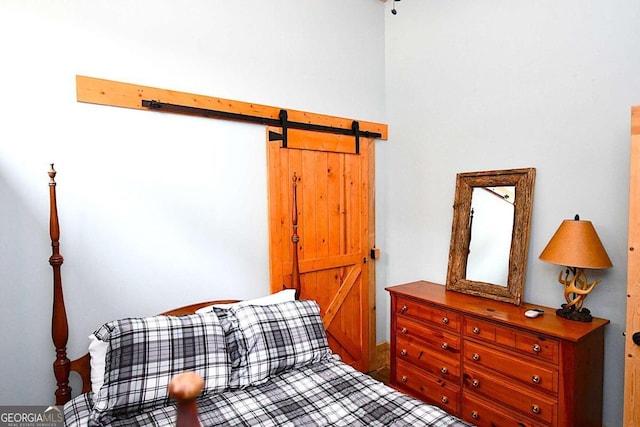 bedroom with a barn door