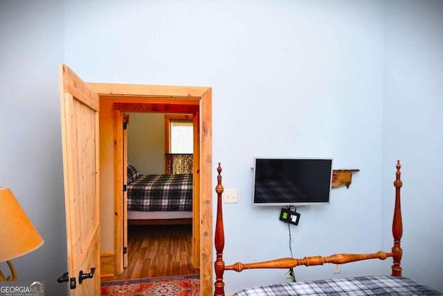 bedroom with wood-type flooring