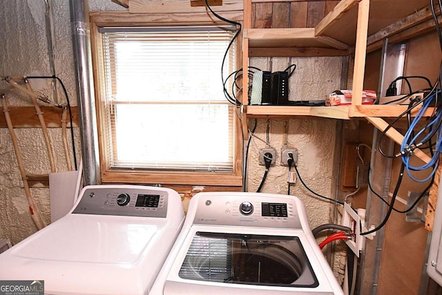 laundry area with plenty of natural light and independent washer and dryer