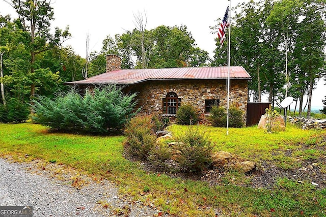 1625 Brushy Mountain Rd, Rockmart, GA 30153 - view of property exterior with stone siding, a chimney, and metal roof