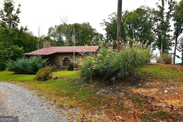 1625 Brushy Mountain Rd, Rockmart, GA 30153 - view of side of home with a chimney and metal roof