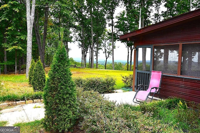 view of yard with a sunroom