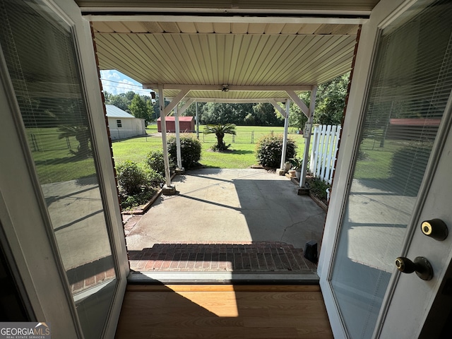 doorway to outside with hardwood / wood-style flooring