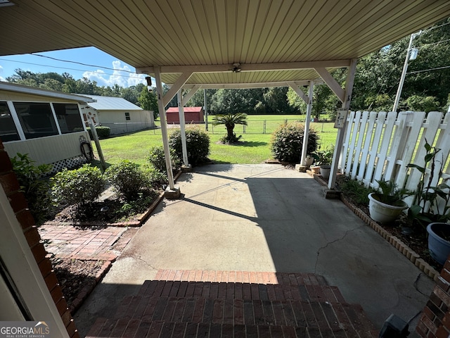 view of patio / terrace featuring a storage unit