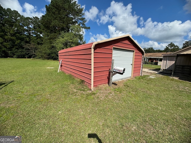 view of outbuilding featuring a yard