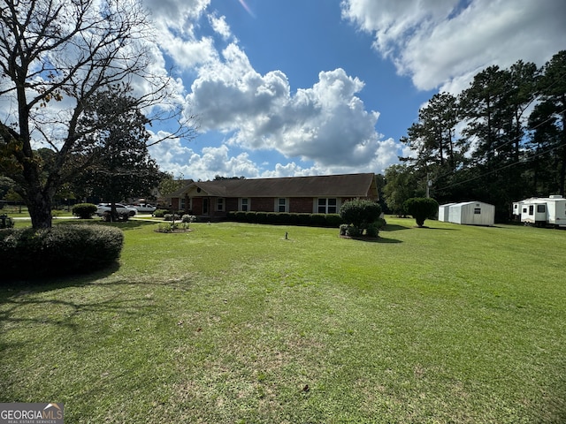 view of yard with a shed