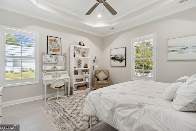 bedroom with recessed lighting, a raised ceiling, visible vents, a ceiling fan, and baseboards