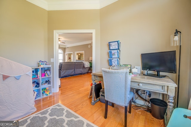 office area with hardwood / wood-style flooring and ornamental molding