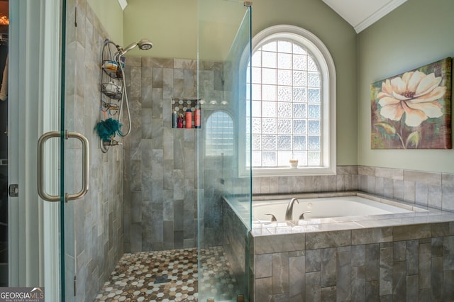 bathroom featuring shower with separate bathtub and lofted ceiling