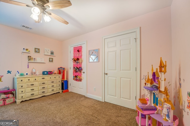 playroom with ceiling fan and carpet flooring