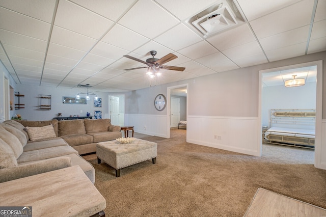 living room featuring ceiling fan and carpet floors