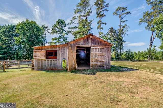 view of outdoor structure featuring a yard