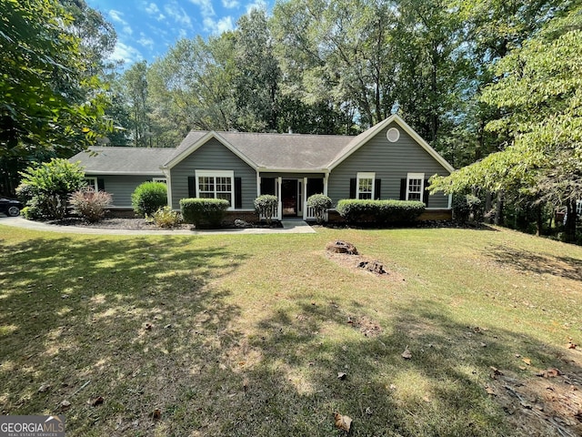 ranch-style home with a front yard