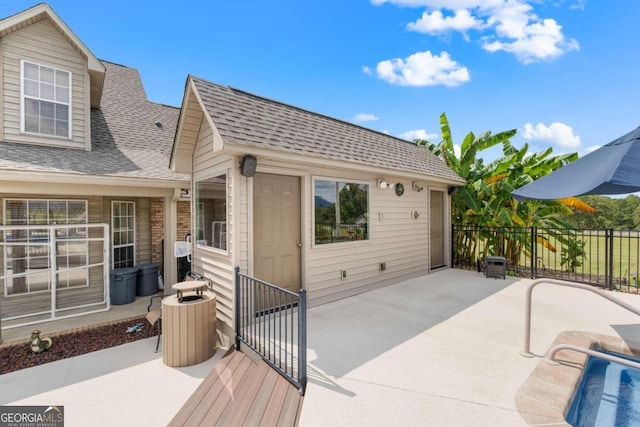 375 Dasher St, Lyons, GA 30436 - back of house with a patio area, fence, and a shingled roof