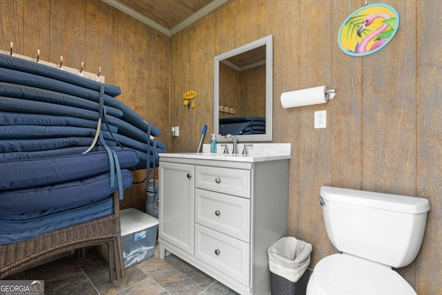 375 Dasher St, Lyons, GA 30436 - bathroom with toilet, wooden walls, crown molding, vanity, and stone finish flooring