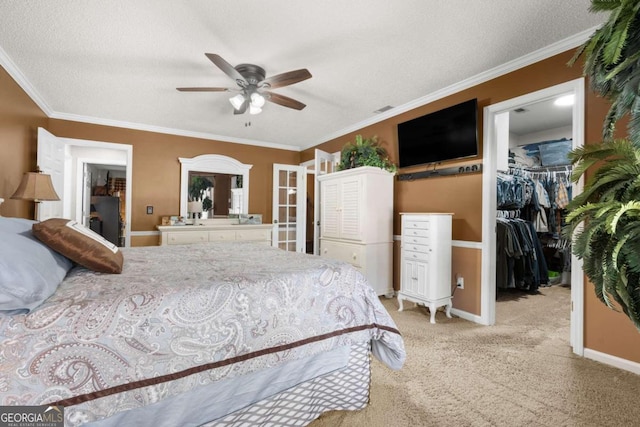 bedroom with ceiling fan, a textured ceiling, a closet, and a spacious closet