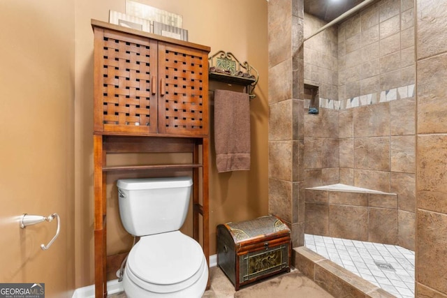 375 Dasher St, Lyons, GA 30436 - full bath featuring tiled shower, baseboards, and toilet