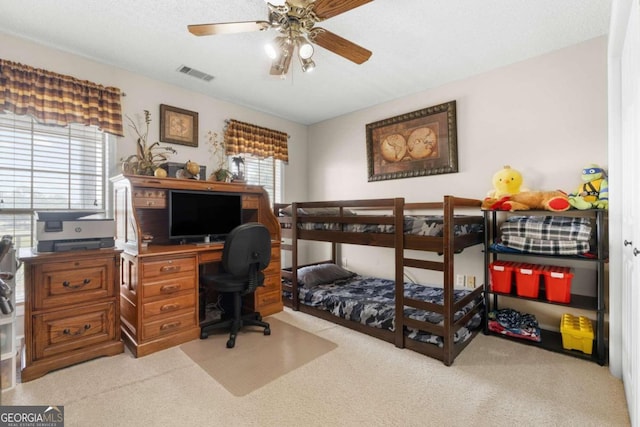 carpeted bedroom with ceiling fan