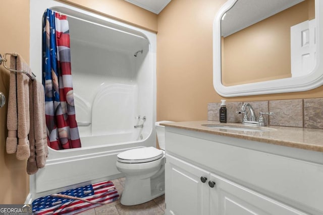 full bathroom featuring shower / bath combo with shower curtain, tile patterned flooring, vanity, and toilet