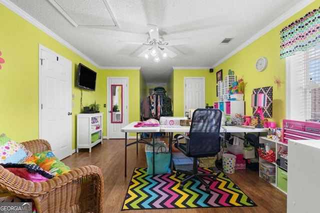 office space featuring a textured ceiling, dark wood-type flooring, and crown molding