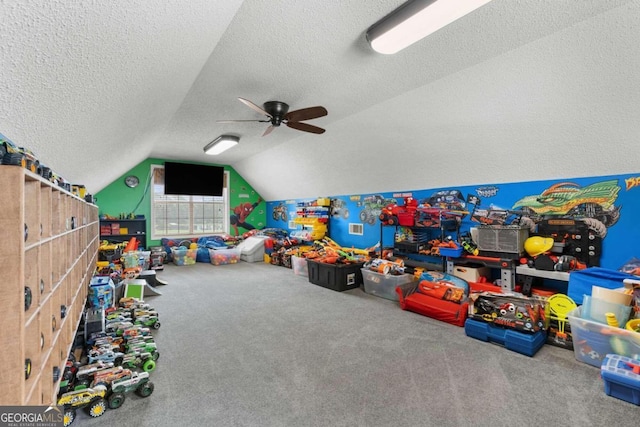 375 Dasher St, Lyons, GA 30436 - playroom with ceiling fan, a textured ceiling, vaulted ceiling, and carpet floors