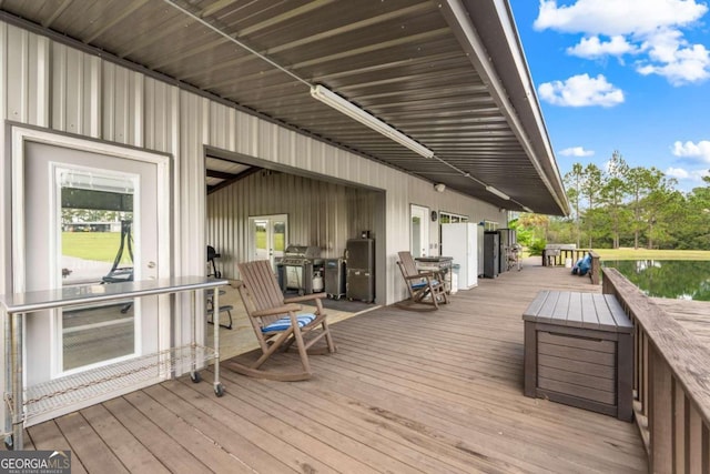 wooden terrace featuring a grill