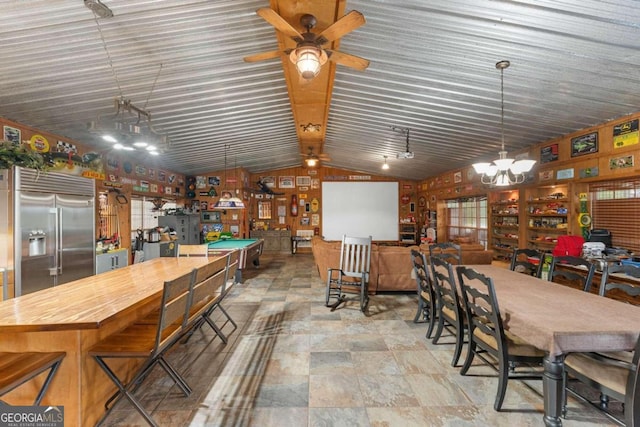 dining area with ceiling fan with notable chandelier and lofted ceiling