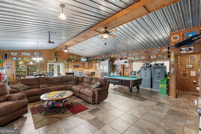 living room featuring lofted ceiling with beams, pool table, ceiling fan, and wood walls