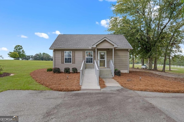 375 Dasher St, Lyons, GA 30436 - view of front of property with a front lawn, aphalt driveway, and roof with shingles
