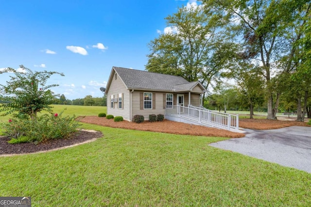 view of front facade with a porch and a front lawn