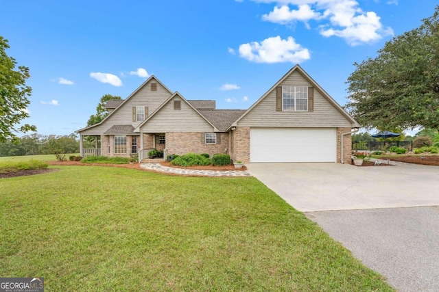 375 Dasher St, Lyons, GA 30436 - craftsman inspired home featuring an attached garage, driveway, a front lawn, and brick siding