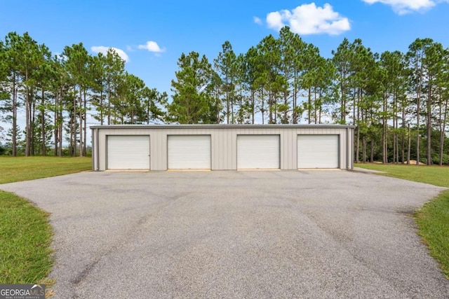 garage featuring a yard