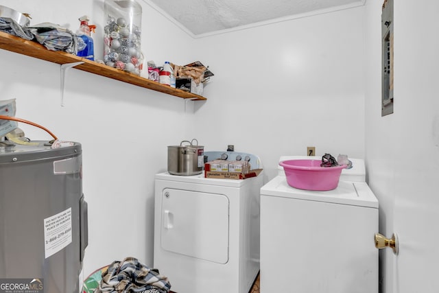 washroom featuring washer and dryer, a textured ceiling, and water heater