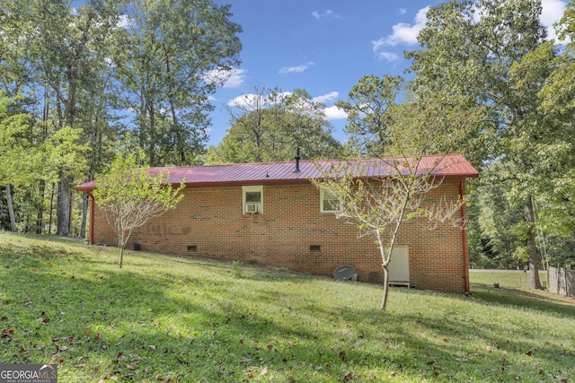 rear view of property with a yard