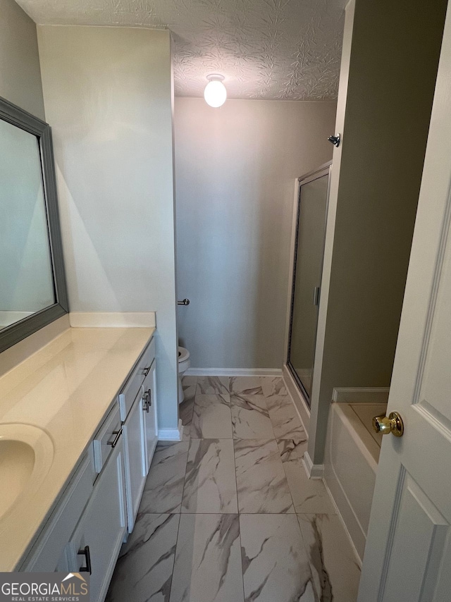 bathroom featuring vanity, shower with separate bathtub, and a textured ceiling