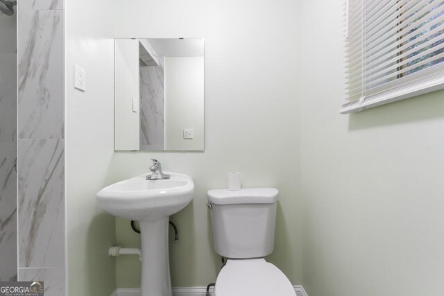 bathroom featuring toilet