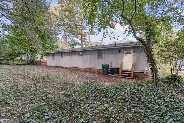 rear view of house with central AC