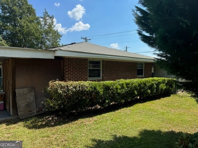 view of home's exterior featuring a yard