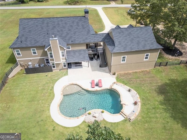 view of pool featuring a yard and a patio area