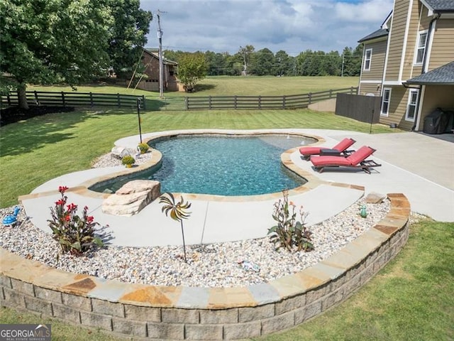 view of pool with a yard and a patio area