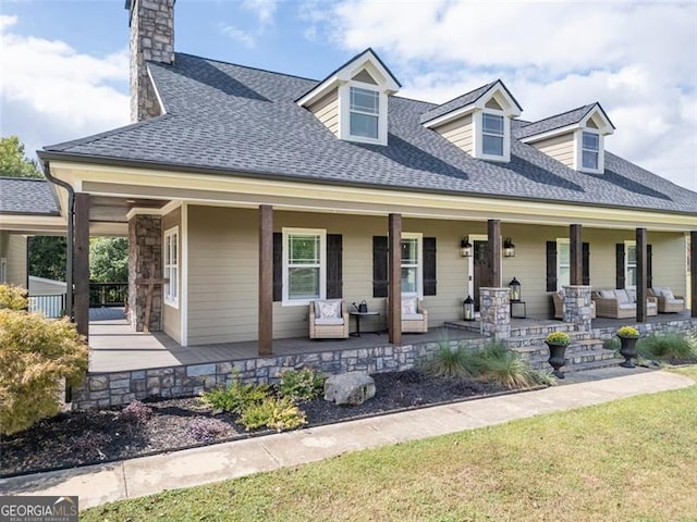 view of front of house with a front lawn and covered porch