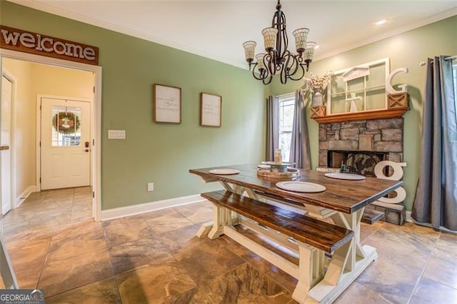 dining area featuring a stone fireplace, a chandelier, and ornamental molding