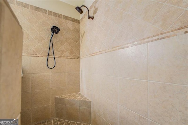 bathroom with a tile shower