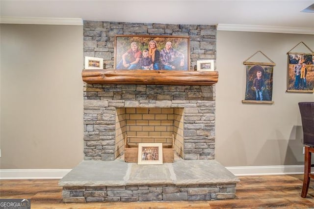 interior details with wood-type flooring, a fireplace, and ornamental molding