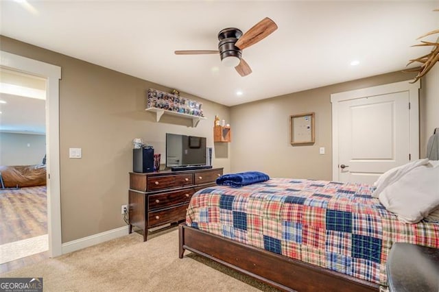 bedroom with light carpet and ceiling fan