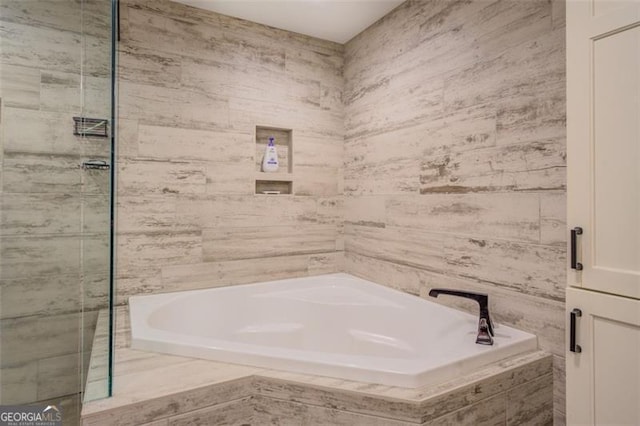 bathroom with shower with separate bathtub