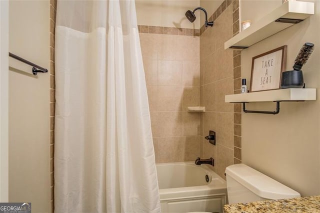 bathroom with shower / tub combo with curtain and toilet