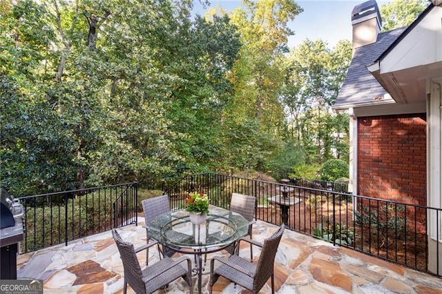 view of patio / terrace with a balcony