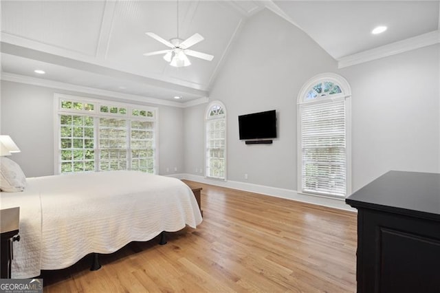 bedroom with ceiling fan, ornamental molding, light hardwood / wood-style floors, and multiple windows