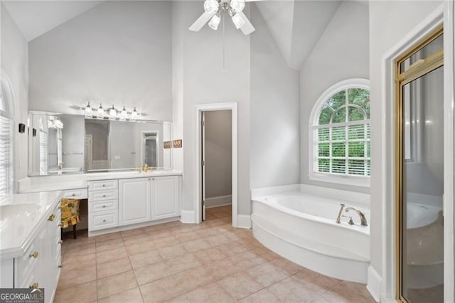 bathroom featuring ceiling fan, vanity, high vaulted ceiling, plus walk in shower, and tile patterned flooring